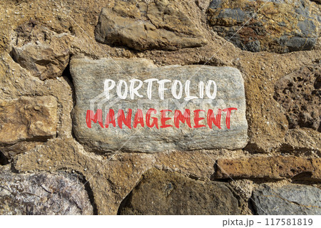 Portfolio management symbol. Concept words Portfolio management on beautiful grey stone. Beautiful stone wall background. Business Portfolio management concept. Copy space. Portfolio management symbol. Concept words Portfolio management on beautiful grey stone. Beautiful stone wall background. Business Portfolio management concept. Copy space. 117581819