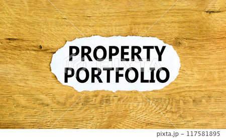 Property portfolio symbol. Concept words Property portfolio on beautiful white paper. Beautiful wooden wall background. Business Property portfolio concept. Copy space. 117581895
