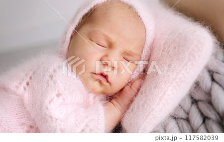 Newborn Baby Sweetly Sleeping In Tiny Bed 117582039