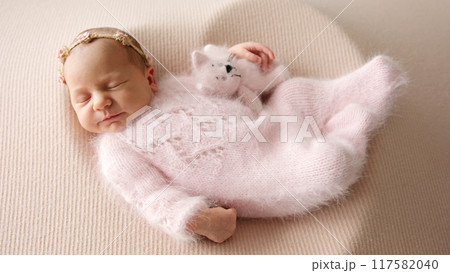 Cute Newborn Baby Girl Asleep With Toy Cute Newborn Baby Girl Asleep With Toy 117582040