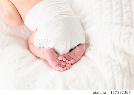 Newborn baby boy in hospital cot Newborn baby boy in hospital cot 117582367