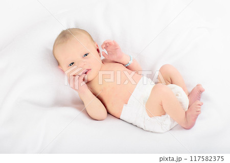Newborn baby boy in hospital cot 117582375