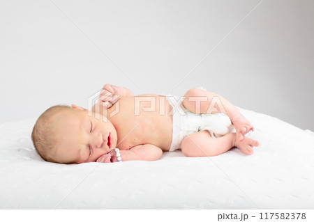 Newborn baby boy in hospital cot 117582378