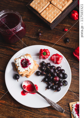 Crackers with Cream Cheese and Chili Pepper Jam Crackers with Cream Cheese and Chili Pepper Jam 117583321