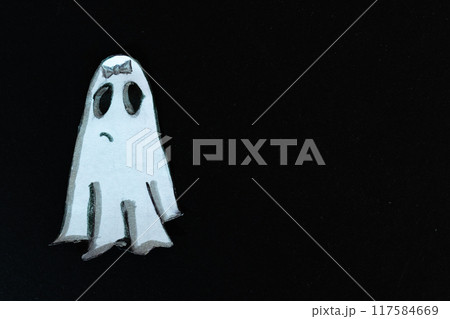 Cute halloween ghost paper cut element in dark background Cute halloween ghost paper cut element in dark background 117584669