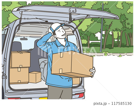 車の前で段ボール箱を持ちながら悩む作業服姿の男性 117585130