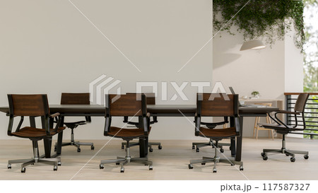 The interior design of a contemporary meeting room featuring a hardwood meeting table. 117587327