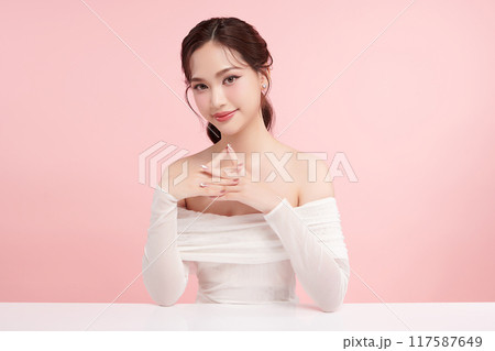 Beautiful young asian woman with clean fresh skin on pink background, Face care, Facial treatment, Cosmetology, beauty and spa, Asian women portrait. 117587649