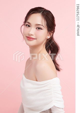 Beautiful young asian woman with clean fresh skin on pink background, Face care, Facial treatment, Cosmetology, beauty and spa, Asian women portrait. 117587661