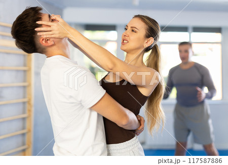 Woman delivers painful blow to eyes of an attacking man - self defense training for women and men Woman delivers painful blow to eyes of an attacking man - self defense training for women and men 117587886