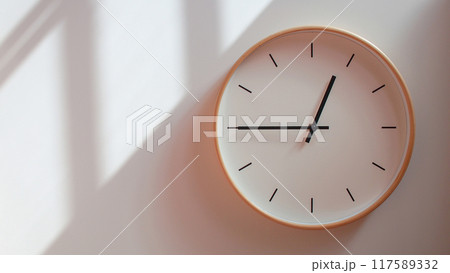Minimalist Wooden Clock at 00.45/12.45 with Soft Shadows on White Wall - Perfect for Time Management and Lifestyle Branding 117589332