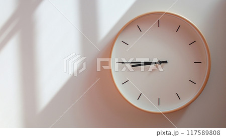 Minimalist Wooden Clock at 20.45/08.45 with Soft Shadows on White Wall - Perfect for Time Management and Lifestyle Branding Minimalist Wooden Clock at 20.45/08.45 with Soft Shadows on White Wall - Perfect for Time Management and Lifestyle Branding 117589808