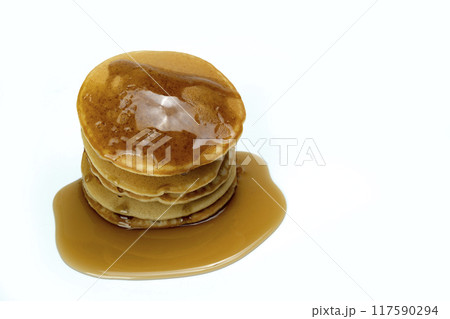 A stack of pancakes with syrup on top 117590294