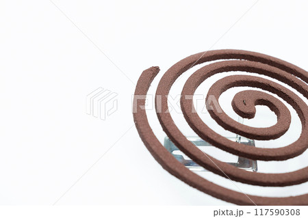 A mosquito coil with smoke coming out of it 117590308