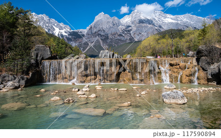 Waterfalls at the foothill of Jade Dragon Snow Mountain in Yulong Naxi Autonomous County, Lijiang, in Yunnan province, China. 117590894