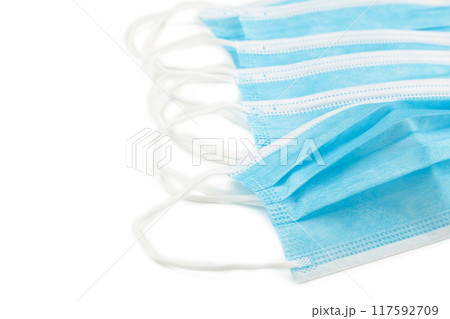 Blue medical face masks isolated on white 117592709