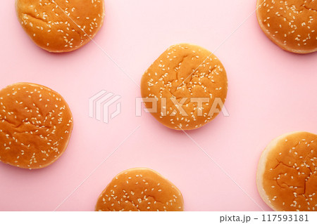 The burger buns on a pink background. The burger buns on a pink background. 117593181