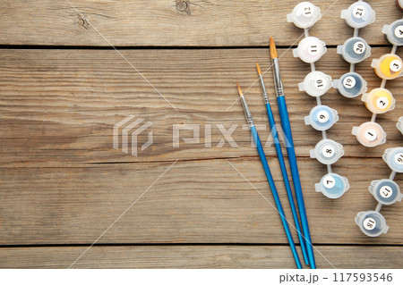 Paints for drawing pictures by numbers on grey background Paints for drawing pictures by numbers on grey background 117593546
