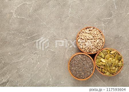 Pumpkin seeds, chia, sunflowers seeds in bowl on grey background 117593604