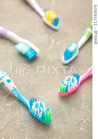 Toothbrushes on grey concrete background with copy space. Toothbrushes on grey concrete background with copy space. 117593670