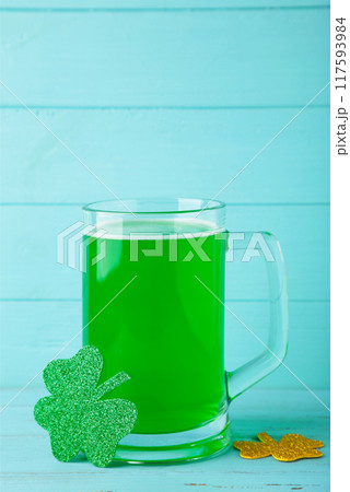 St. Patricks Day, green shamrock with beer on blue background 117593984