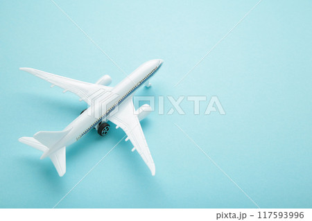 Model airplane on blue pastel color background. Model airplane on blue pastel color background. 117593996