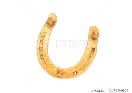 Gold horseshoe isolated on a white background Gold horseshoe isolated on a white background 117594005
