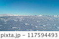 Snow ice field arctic polar environment. Snow-covered Antarctica ocean, frozen wild nature beauty. Untouched landscape under blue sky. Majestic winter scene. South Pole travel background. Low angle 117594493