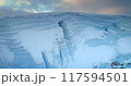 Towering ice cliff in sunset Antarctic landscape, toward colorful sky. Breathtaking scene of an Antarctica iceberg. Arctic environment preserve of ice. Huge high glacier at polar nature. Aerial shot 117594501