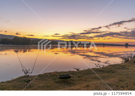 Carp fishing rods at sunrise. Carp fishing rods at sunrise. 117594954