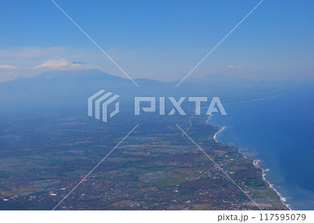Aerial view from wimdow airplane sky summer tropical blue sky fluffy white cloud summertime on light sunny day cloudscape ocean seascape. Clear bright blue skyline spring sunlight climate background Aerial view from wimdow airplane sky summer tropical blue sky fluffy white cloud summertime on light sunny day cloudscape ocean seascape. Clear bright blue skyline spring sunlight climate background 117595079