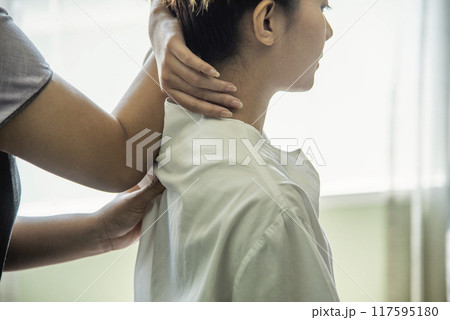 Massage Thai Spa neck shoulder arm hands massaging. Close up woman neck office syndrome therapy relax treatment spa salon. Women body tight muscle relief neck and sholder pain massage. Body therapist Massage Thai Spa neck shoulder arm hands massaging. Close up woman neck office syndrome therapy relax treatment spa salon. Women body tight muscle relief neck and sholder pain massage. Body therapist 117595180