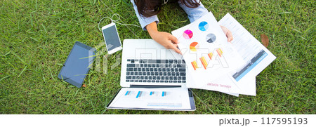 Banner Asian entrepreneur business woman reading business graph analyze chart using laptop on green garden at home. Panorama women Freelance working home office at cafe green park with copy space Banner Asian entrepreneur business woman reading business graph analyze chart using laptop on green garden at home. Panorama women Freelance working home office at cafe green park with copy space 117595193