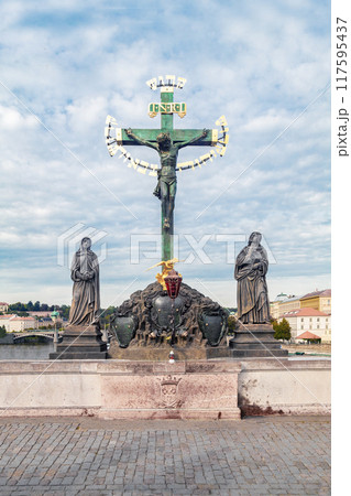 Calvary sculpture on the Charles Bridge in Prague, Czech Republic 117595437