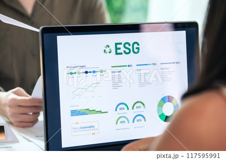 diversity team brainstorming focused on ESG (environment,social,governance) with tablet or sdgs goals in a sustainable green office at night diversity team brainstorming focused on ESG (environment,social,governance) with tablet or sdgs goals in a sustainable green office at night 117595991