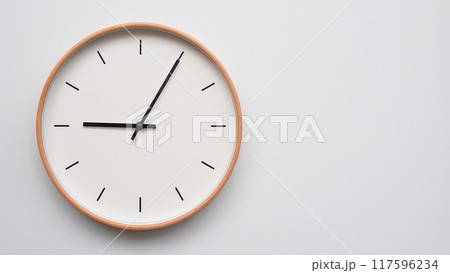 Minimalist wooden Wall Clock on White Wooden Surface with Space for Text. Time Set at 21.05/09.05 Minimalist wooden Wall Clock on White Wooden Surface with Space for Text. Time Set at 21.05/09.05 117596234