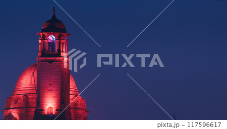 New Delhi, Delhi, India. Close up of Rashtrapati Bhavan, Bell tower and Ministry of External Affairs in Kartavya Path, Rajpath Area. Rashtrapati Bhavan in evening night illumination lights lighting 117596617
