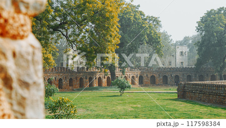 New Delhi, Delhi, India. Old wall surrounded Isa Khan's Tomb near The Humayun's tomb. Famous place is Tomb of Mughal emperor, Mirza Nasir al-Din Muhammad commonly known as Humayun situated in Delhi 117598384