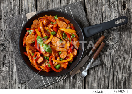 zesty italian sausage peppers and onions, top view 117599201