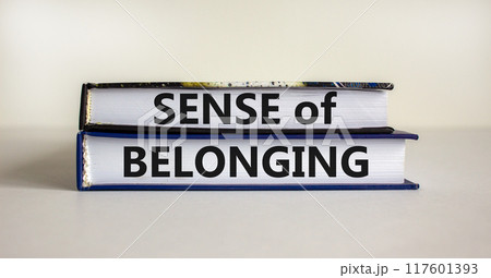 Sense of belonging symbol. Books with words 'sense of belonging' on beautiful white background. Business, sense of belonging concept. Copy space. Sense of belonging symbol. Books with words 'sense of belonging' on beautiful white background. Business, sense of belonging concept. Copy space. 117601393