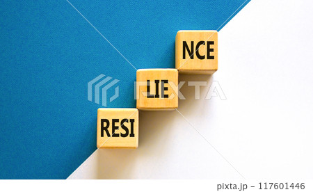 Resilience symbol. Concept word Resilience on beautiful wooden blocks. Beautiful white and blue background. Business resilience concept. Copy space. 117601446
