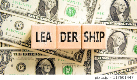 Leadership symbol. Concept word Leadership on beautiful wooden blocks. Dollar bills. Beautiful background from dollar bills. Business leadership concept. Copy space. Leadership symbol. Concept word Leadership on beautiful wooden blocks. Dollar bills. Beautiful background from dollar bills. Business leadership concept. Copy space. 117601447