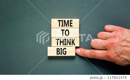 Time to think big symbol. Concept words Time to think big on beautiful wooden block. Beautiful grey table grey background. Businessman hand. Business and time to think big concept. Copy space. 117601478