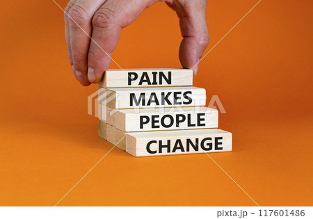 Pain makes people change symbol. Concept words Pain makes people change on wooden blocks on a beautiful orange table orange background. Business, motivational and pain makes people change concept. Pain makes people change symbol. Concept words Pain makes people change on wooden blocks on a beautiful orange table orange background. Business, motivational and pain makes people change concept. 117601486