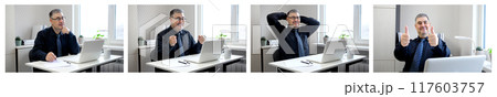 Businessman Giving Thumbs Up While Looking at Computer Screen 117603757