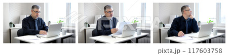 A man is working at his office desk. A man is working at his office desk. 117603758