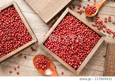 Red beans in a wooden box on a wooden board 117604832