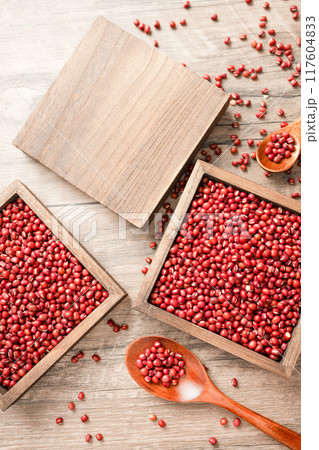 Red beans in a wooden box on a wooden board 117604833