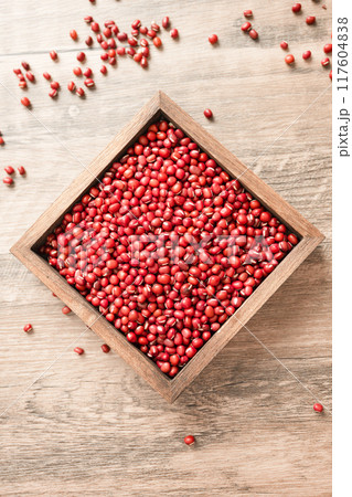 Red beans in a wooden box on a wooden board 117604838