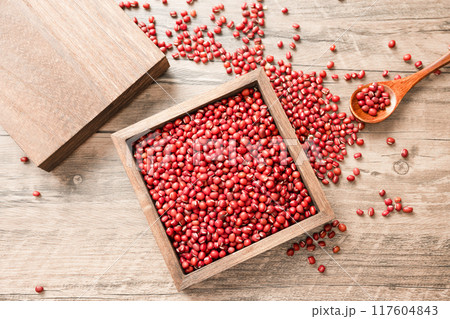 Red beans in a wooden box on a wooden board 117604843